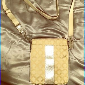 Authentic coach excellent condition, never used only stored; gold/silver accents